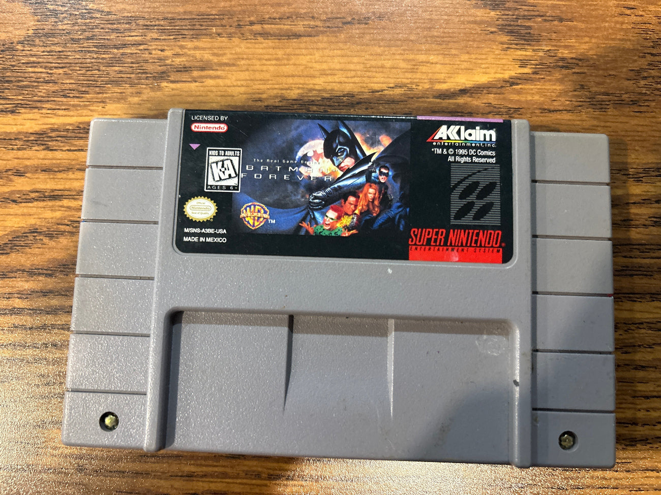 Super Nintendo Entertainment System game cartridge for Batman Forever