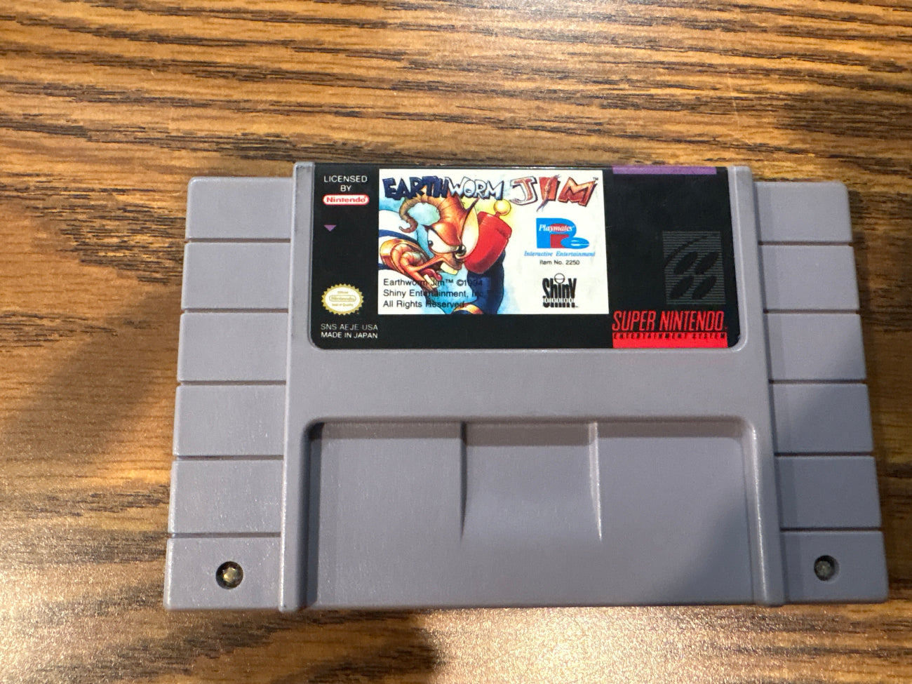 Super Nintendo Entertainment System game cartridge for Earthworm Jim