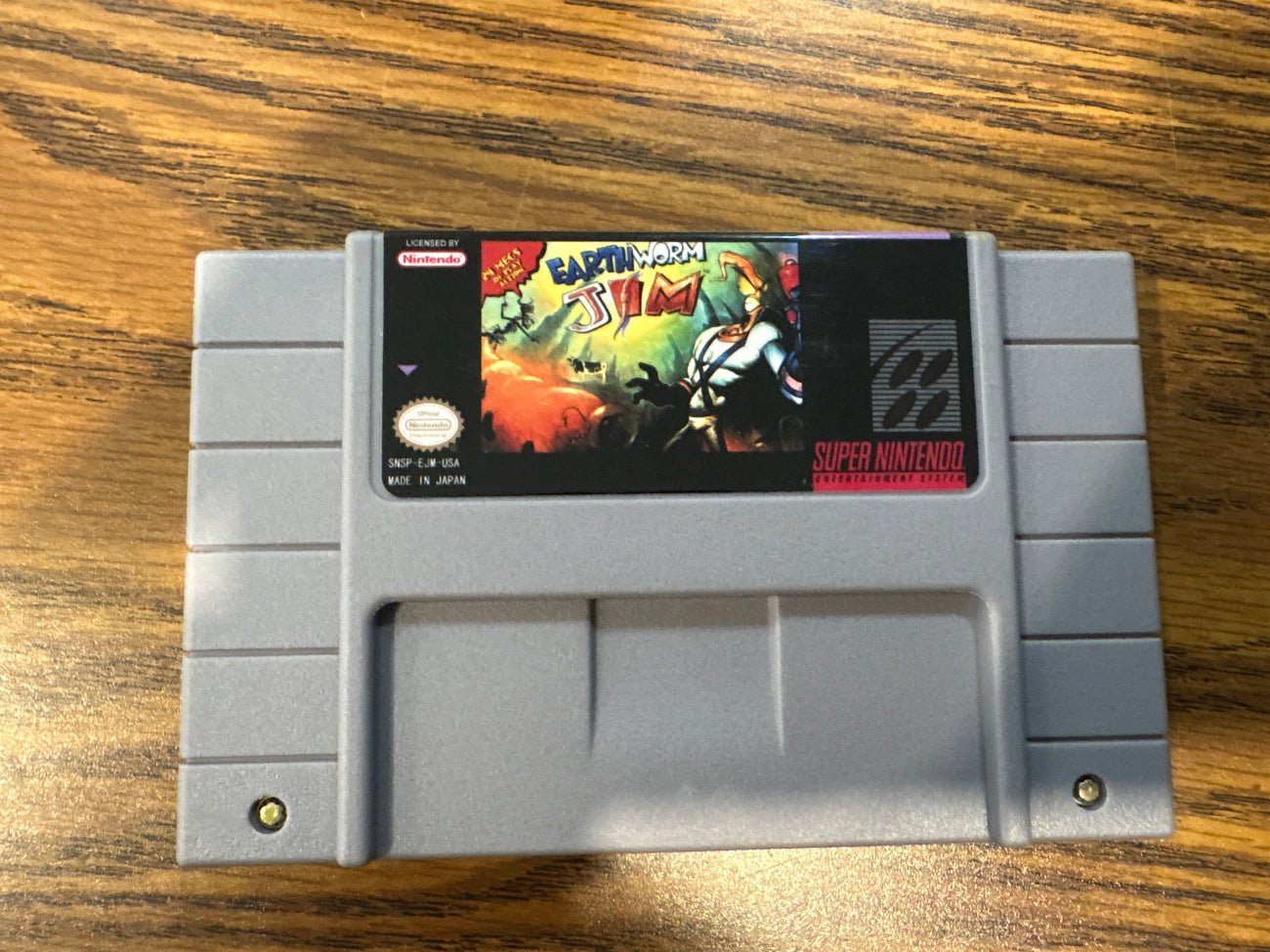 Super Nintendo Entertainment System game cartridge of earthworm jim