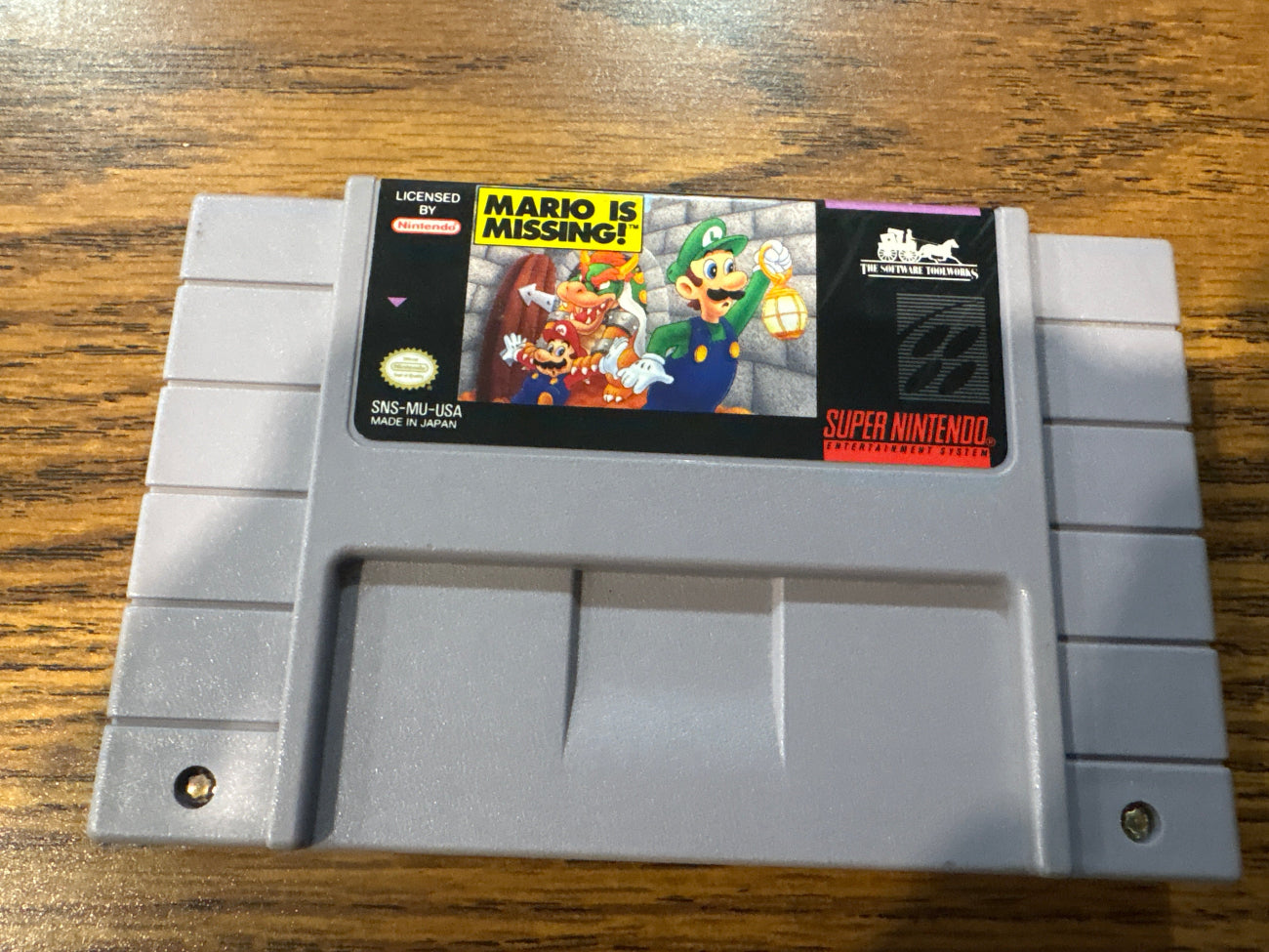 Super Nintendo Entertainment System game cartridge with 'Mario is Missing!' 