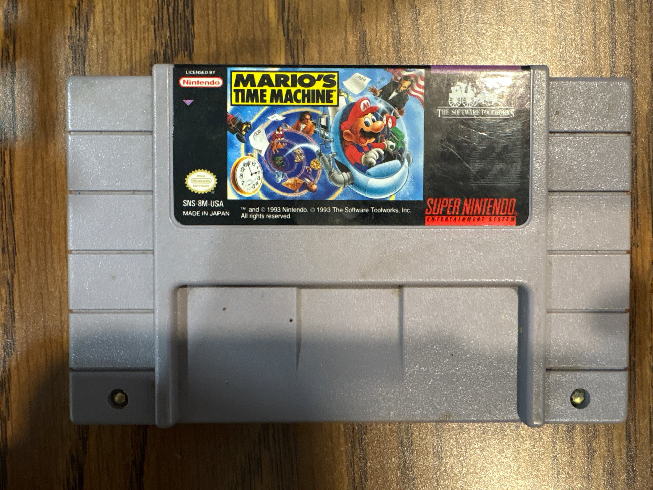 Super Nintendo Entertainment System game cartridge with Mario's Time Machine