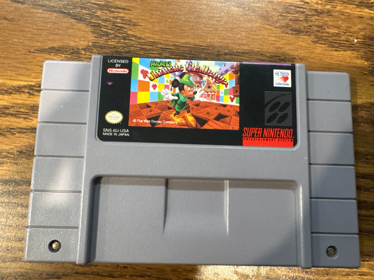Super Nintendo Entertainment System game cartridge for mickey's ultimate challenge