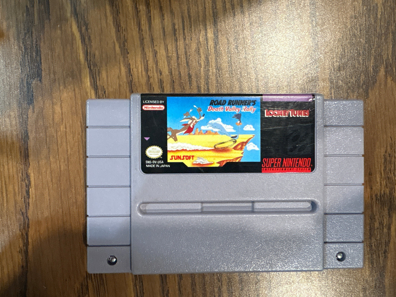 Super Nintendo Entertainment System game cartridge of road runner's death valley rally