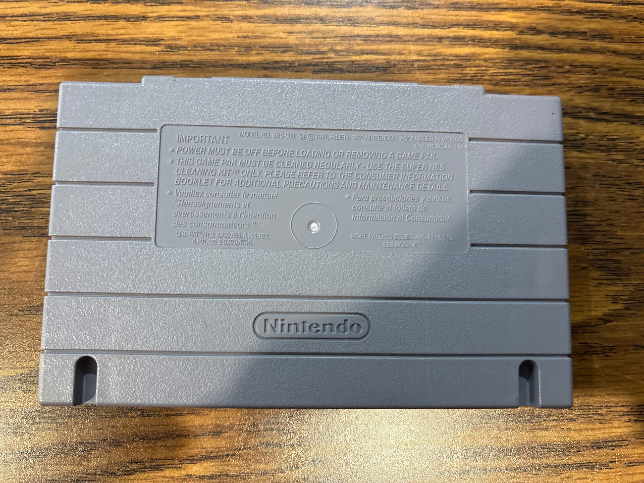 Back of Spider-Man and the X-Men in Arcade's Revenge Super Nintendo game cartridge